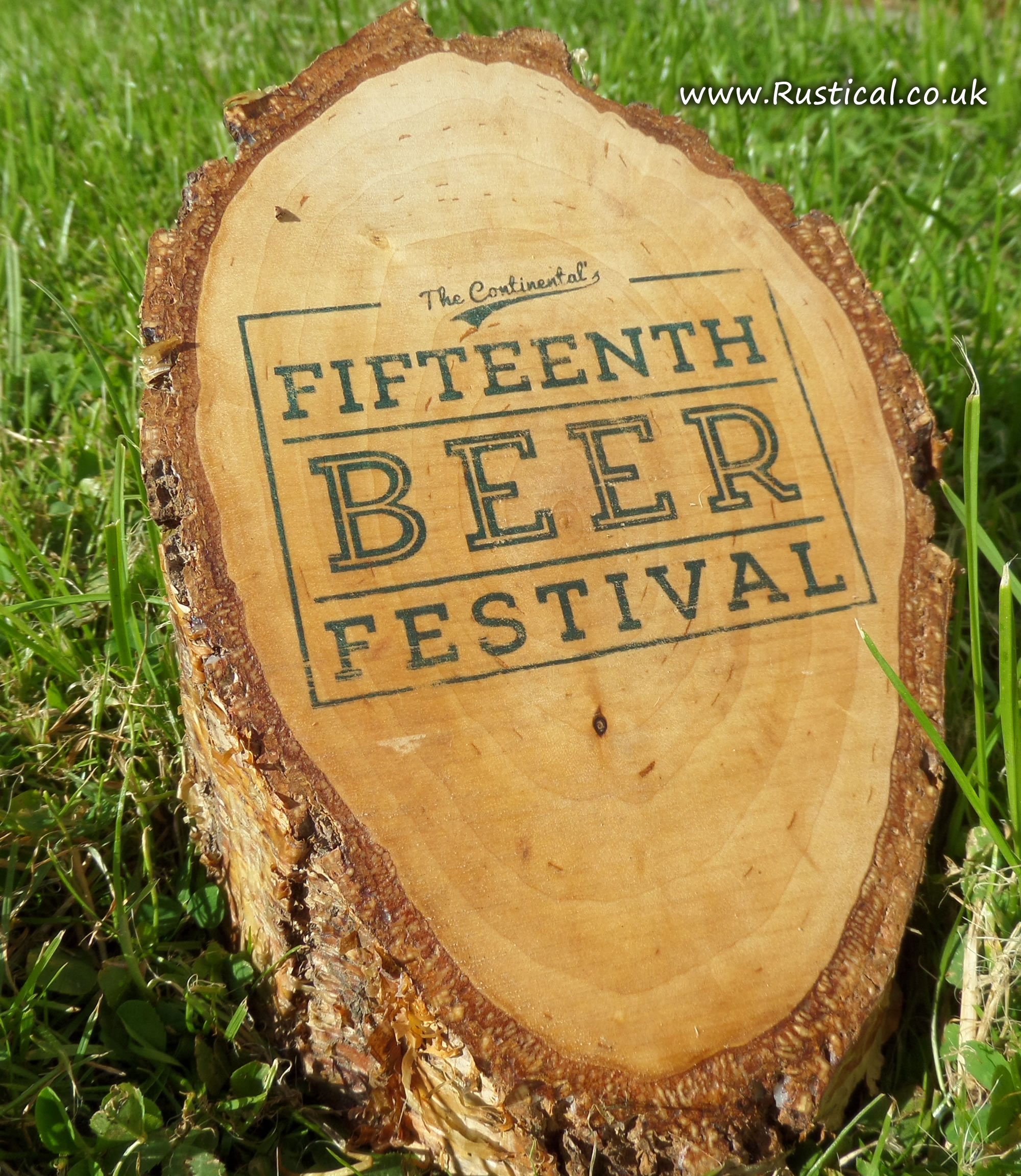 An event logo printed onto a birch log