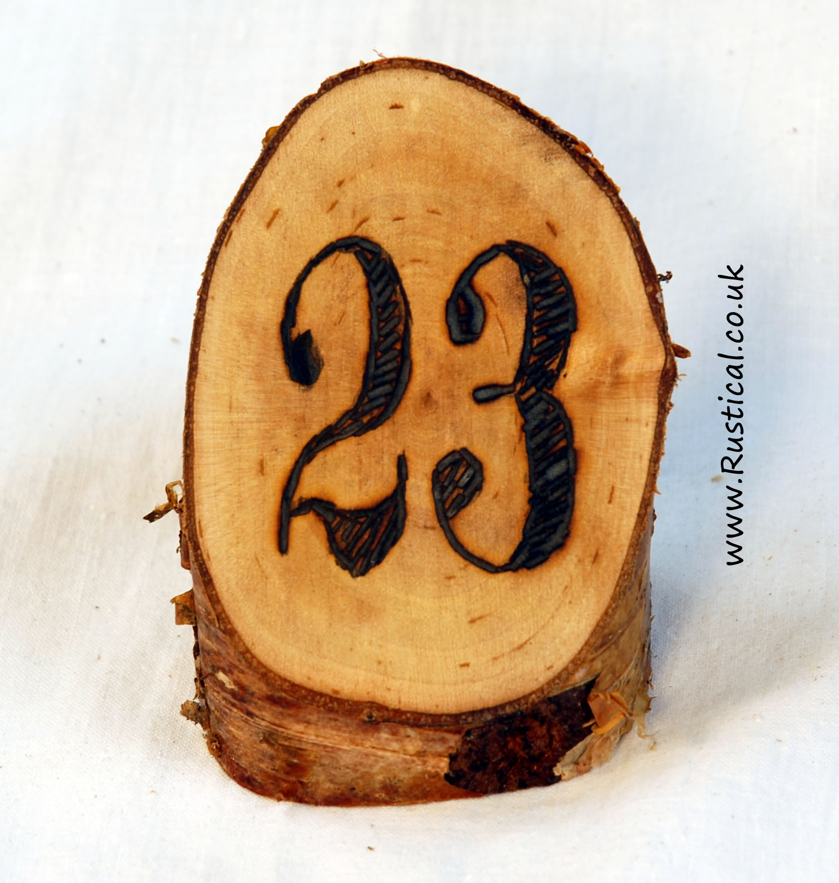 Branded rustic log table numbers